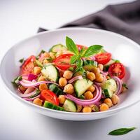 Vegetarian chickpea salad prepared with tomatoes, cucumber, red onion, cress salad and arugula, White Background, photo