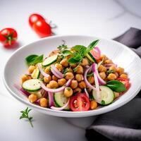 Vegetarian chickpea salad prepared with tomatoes, cucumber, red onion, cress salad and arugula, White Background, photo