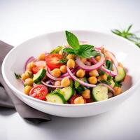 Vegetarian chickpea salad prepared with tomatoes, cucumber, red onion, cress salad and arugula, White Background, photo