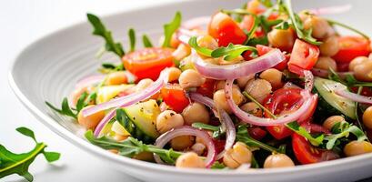 Vegetarian chickpea salad prepared with tomatoes, cucumber, red onion, cress salad and arugula, White Background, photo