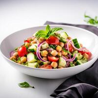 Vegetarian chickpea salad prepared with tomatoes, cucumber, red onion, cress salad and arugula, White Background, photo