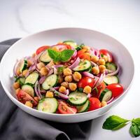 Vegetarian chickpea salad prepared with tomatoes, cucumber, red onion, cress salad and arugula, White Background, photo