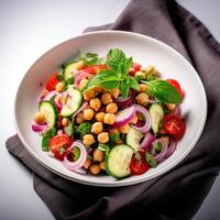 Vegetarian chickpea salad prepared with tomatoes, cucumber, red onion, cress salad and arugula, White Background, photo