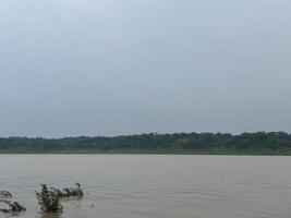 A calm river flowing in monsoon photo