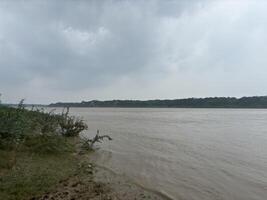 A calm river flowing naturally in monsoon photo