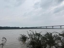 A calm river flowing naturally in monsoon season photo
