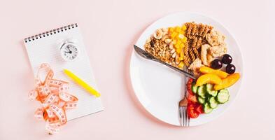 Set of healthy food for individual meal plan on plate on table top view web banner photo