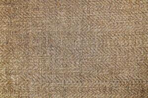 Natural Linen Material Textile Canvas Fabric Texture Background Close-up Detail of Fabric Natural Color Hemp Material Pattern Design Wallpaper. Can be Used as Background or For Graphic Design photo