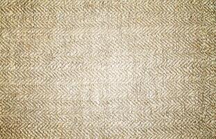 Natural Linen Material Textile Canvas Fabric Texture Background Close-up Detail of Fabric Natural Color Hemp Material Pattern Design Wallpaper. Can be Used as Background or For Graphic Design photo
