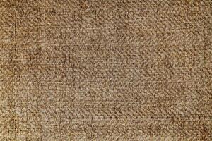 Natural Linen Material Textile Canvas Fabric Texture Background Close-up Detail of Fabric Natural Color Hemp Material Pattern Design Wallpaper. Can be Used as Background or For Graphic Design photo