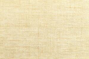 Natural Linen Material Textile Canvas Fabric Texture Background Close-up Detail of Fabric Natural Color Hemp Material Pattern Design Wallpaper. Can be Used as Background or For Graphic Design photo
