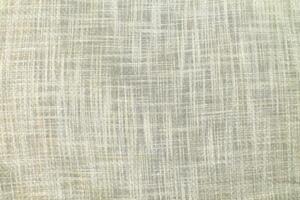 Natural Linen Material Textile Canvas Fabric Texture Background Close-up Detail of Fabric Natural Color Hemp Material Pattern Design Wallpaper. Can be Used as Background or For Graphic Design photo