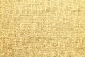 Natural Linen Material Textile Canvas Fabric Texture Background Close-up Detail of Fabric Natural Color Hemp Material Pattern Design Wallpaper. Can be Used as Background or For Graphic Design photo
