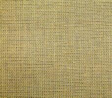 Natural Linen Material Textile Canvas Fabric Texture Background Close-up Detail of Fabric Natural Color Hemp Material Pattern Design Wallpaper. Can be Used as Background or For Graphic Design photo