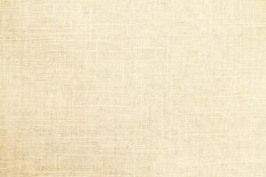 Natural Linen Material Textile Canvas Fabric Texture Background Close-up Detail of Fabric Natural Color Hemp Material Pattern Design Wallpaper. Can be Used as Background or For Graphic Design photo