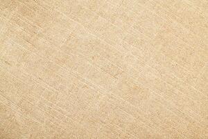 Natural Linen Material Textile Canvas Fabric Texture Background Close-up Detail of Fabric Natural Color Hemp Material Pattern Design Wallpaper. Can be Used as Background or For Graphic Design photo