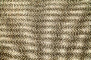 Natural Linen Material Textile Canvas Fabric Texture Background Close-up Detail of Fabric Natural Color Hemp Material Pattern Design Wallpaper. Can be Used as Background or For Graphic Design photo