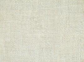 Natural Linen Material Textile Canvas Fabric Texture Background Close-up Detail of Fabric Natural Color Hemp Material Pattern Design Wallpaper. Can be Used as Background or For Graphic Design photo