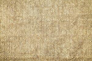 Natural Linen Material Textile Canvas Fabric Texture Background Close-up Detail of Fabric Natural Color Hemp Material Pattern Design Wallpaper. Can be Used as Background or For Graphic Design photo