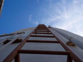 Ladder staircase stairway climb blue sky challenge work problem adversity success copy space job occupation career industry solution opportunity tool progress difficult idea motivation success risk photo