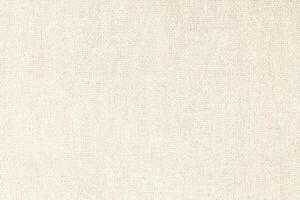 Natural Linen Material Textile Canvas Fabric Texture Background Close-up Detail of Fabric Natural Color Hemp Material Pattern Design Wallpaper. Can be Used as Background or For Graphic Design photo