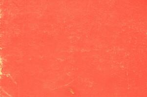 An old red book with a hole in the middle photo