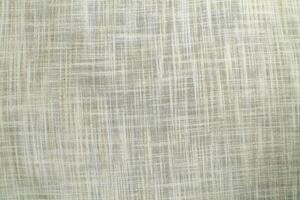 Natural Linen Material Textile Canvas Fabric Texture Background Close-up Detail of Fabric Natural Color Hemp Material Pattern Design Wallpaper. Can be Used as Background or For Graphic Design photo
