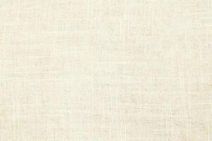 Natural Linen Material Textile Canvas Fabric Texture Background Close-up Detail of Fabric Natural Color Hemp Material Pattern Design Wallpaper. Can be Used as Background or For Graphic Design photo