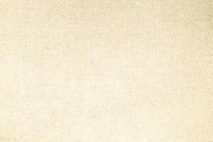 Natural Linen Material Textile Canvas Fabric Texture Background Close-up Detail of Fabric Natural Color Hemp Material Pattern Design Wallpaper. Can be Used as Background or For Graphic Design photo