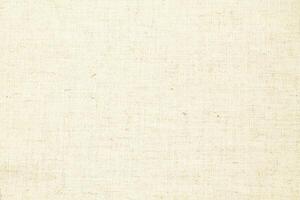 Natural Linen Material Textile Canvas Fabric Texture Background Close-up Detail of Fabric Natural Color Hemp Material Pattern Design Wallpaper. Can be Used as Background or For Graphic Design photo