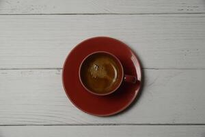 Hot espresso in a red glass photo