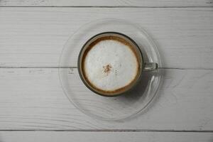 Hot cappuccino, add clmeme. photo