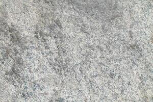 Abstract natural rock stone granite grunge rusty metal texture design background natural color stone material granite design wallpaper. Close-up detail of natural stone photo