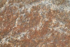 Abstract natural rock stone granite grunge rusty metal texture design background natural color stone material granite design wallpaper. Close-up detail of natural stone photo