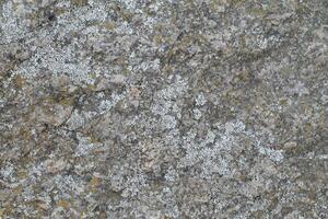 Abstract natural rock stone granite grunge rusty metal texture design background natural color stone material granite design wallpaper. Close-up detail of natural stone photo