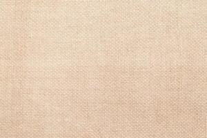 Natural linen material textile canvas Fabric texture background Close-up detail of fabric natural color Hemp material pattern design wallpaper. can be used as background or for graphic design photo