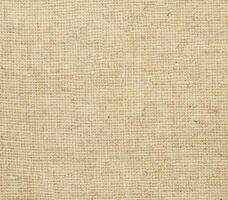 Natural linen material textile canvas Fabric texture background Close-up detail of fabric natural color Hemp material pattern design wallpaper. can be used as background or for graphic design photo