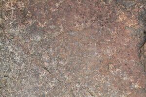 Abstract natural rock stone granite grunge rusty metal texture design background natural color stone material granite design wallpaper. Close-up detail of natural stone photo