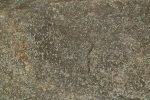 Abstract natural rock stone granite grunge rusty metal texture design background natural color stone material granite design wallpaper. Close-up detail of natural stone photo