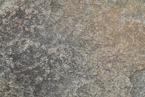 Abstract natural rock stone granite grunge rusty metal texture design background natural color stone material granite design wallpaper. Close-up detail of natural stone photo