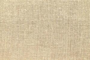 Natural linen material textile canvas Fabric texture background Close-up detail of fabric natural color Hemp material pattern design wallpaper. can be used as background or for graphic design photo