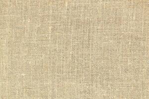 Natural linen material textile canvas Fabric texture background Close-up detail of fabric natural color Hemp material pattern design wallpaper. can be used as background or for graphic design photo