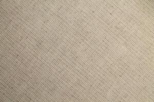Natural linen material textile canvas Fabric texture background Close-up detail of fabric natural color Hemp material pattern design wallpaper. can be used as background or for graphic design photo