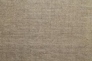 Natural linen material textile canvas Fabric texture background Close-up detail of fabric natural color Hemp material pattern design wallpaper. can be used as background or for graphic design photo