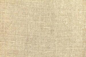 Natural linen material textile canvas Fabric texture background Close-up detail of fabric natural color Hemp material pattern design wallpaper. can be used as background or for graphic design photo