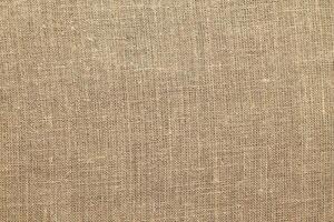 Natural linen material textile canvas Fabric texture background Close-up detail of fabric natural color Hemp material pattern design wallpaper. can be used as background or for graphic design photo