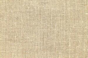 Natural linen material textile canvas Fabric texture background Close-up detail of fabric natural color Hemp material pattern design wallpaper. can be used as background or for graphic design photo
