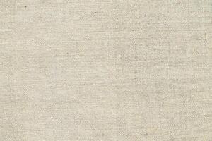 Natural linen material textile canvas Fabric texture background Close-up detail of fabric natural color Hemp material pattern design wallpaper. can be used as background or for graphic design photo