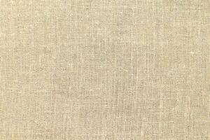 Natural linen material textile canvas Fabric texture background Close-up detail of fabric natural color Hemp material pattern design wallpaper. can be used as background or for graphic design photo