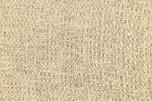 Natural linen material textile canvas Fabric texture background Close-up detail of fabric natural color Hemp material pattern design wallpaper. can be used as background or for graphic design photo